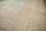 Distressed Sivas carpet corner showing jook and latch border with worn peach and ivory tones.