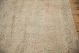 Heavy wear and visible foundation on distressed Sivas carpet, with faded peach and ivory motifs.