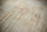 Distressed Sivas carpet showing heavy wear, visible foundation, and faded peach and ivory texture.