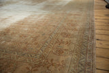 Textured pile of a vintage distressed Sivas carpet, showing worn beige, red, and silver patterns.