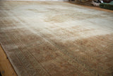 Distressed texture and visible foundation on a vintage Sivas carpet in ivory and beige.