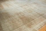 Distressed vintage Sivas carpet texture showing foundation and faded floral motifs.