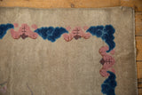 Antique Art Deco rug corner: beige, cobalt blue, blush cloud motifs, intact selvage.