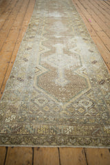 Distressed vintage Hamadan runner, showing geometric patterns and worn ivory and muted blue tones.