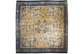 Collector antique Chinese Ningxia square carpet, saffron field, cobalt blue floral designs, roundel medallion, visible wear.