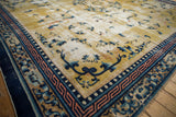 Antique Chinese Ningxia rug corner with pearl motif, geometric borders, and saffron field.