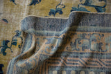 Reverse of antique Ningxia carpet, displaying blue striped foundation and worn saffron, cobalt pile.
