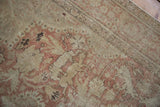Distressed vintage Kayseri rug field with deer, antelope motifs, and worn dusty rose pile.
