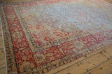 Distressed texture of this Vintage Kayseri rug, showing faded traditional motifs in cream and rust.