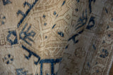 Detailed texture of a distressed Persian Karaja rug showing the low, hand-knotted pile.