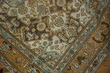 Distressed Malayer runner corner, worn brown, ivory, and blue floral motifs.