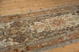 Worn pile texture of a distressed Persian Malayer rug with rust and ivory patterns.