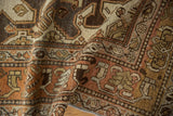 Worn pile texture and intricate Herati-like patterns in rust, charcoal, and antique ivory.