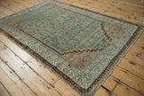 Distressed pile texture of Serbend rug with staggered boteh design and stepped spandrel.