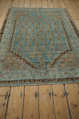 Distressed pile texture, fringed bottom border, and stepped spandrel of vintage Serbend rug.