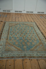 Distressed Serbend rug corner, abrashed dusty blue field, boteh, stepped spandrel, vine border.