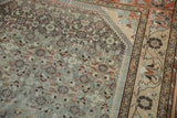 Even wear on the knot heads of a distressed Borchalou rug's Herati pattern and floral border.
