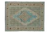 Distressed hand-knotted Bibikabad rug featuring diamond medallion, Herati motif, in powder blue and sand.