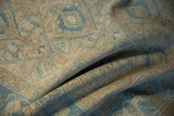 Soft folds of a distressed Hamadan rug highlighting its low pile and evenly worn texture.