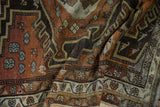 Distressed texture and tiered floral borders with inverted colors on a vintage Malayer runner.