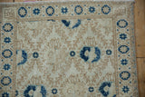 Distressed Sparta rug with visible knot heads and faint foundation in cobalt blue, ivory hues.