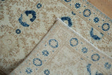 Distressed ivory and navy cobalt blue Sparta rug pile, showing foundation and woven reverse.