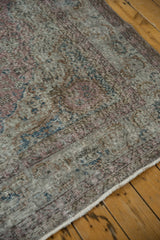 Distressed vintage Sparta carpet pile showing foundation, dusty raspberry and navy tones.