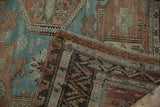 Distressed vintage Soumac rug flatweave, geometric patterns in blue, terracotta, and brown.