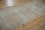 Close-up of Oushak rug runner showing worn pile, visible foundation, and subtle color blend.