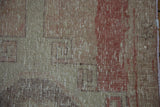 Distressed Oushak runner close-up, showing worn pile, geometric motif in muted ivory and blush.
