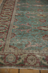 Distressed Kayseri field with ocean green, cherry red floral motifs and visible abrashes.
