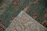 Distressed vintage Kayseri rug, ocean green pile with heavy abrash, and muted floral reverse.