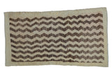 Distressed vintage Tulu rug with geometric cream and brown chevron patterns, 3'4