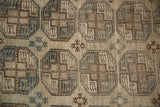 Hand-knotted vintage Ersari rug, distressed camel, beige, slate geometric gul medallions.
