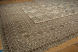 Distressed Ersari rug border, primitive geometric patterns, camel and chocolate brown tones.