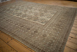 Worn texture on distressed Ersari carpet, showing intricate traditional borders and gul medallions.