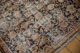 Worn Herati design and visible antique ivory foundation of a distressed Hamadan rug.