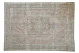 Distressed Sparta carpet with faded pink, blue, and ivory floral medallion design, 7'1