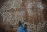Distressed vintage Sivas carpet showcasing faded ivory, chestnut rust sprawling floral vinery and worn texture.
