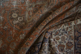 Patinaed texture of a distressed Sivas carpet with chestnut rust and silver patterns.