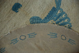 Tightly woven reverse of vintage Art Deco rug, with blue geometric border motifs.
