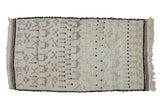 Vintage Moroccan rug, ivory high pile, with stylized pictorial motifs in oxidized silver and black.