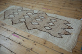 Vintage Moroccan runner, primitive geometric pattern in ivory, beige, dark brown with abrashes.