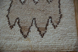 Shaggy pile of vintage Moroccan runner, primitive dark brown geometric motifs and natural abrashes.