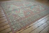 Vintage Distressed Afghani Soumac carpet with distinct starburst and wave borders.