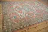 Distressed Soumac rug border detail, starbursts, wave patterns, dusty blush, pale blue hues.