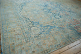 Distressed Northwest Persian carpet corner with powder blue, pale coffee floral border.