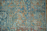 Distressed Northwest Persian carpet showing artistic floral palmettes in powder blue and terracotta with ivory accents.