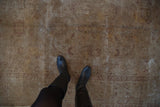 Distressed vintage Sivas carpet texture with faded gold, aubergine lotus and visible foundation.