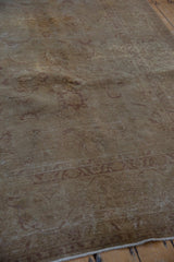Vintage Distressed Sivas Carpet's textured pile with faded gold and aubergine florals.